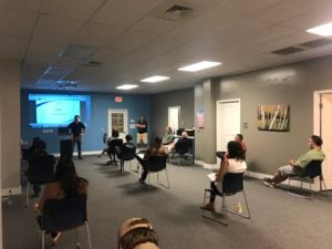 Photo Steve Bulger, COO of lite prepcenter, presenting the new core values to a small group of employees.