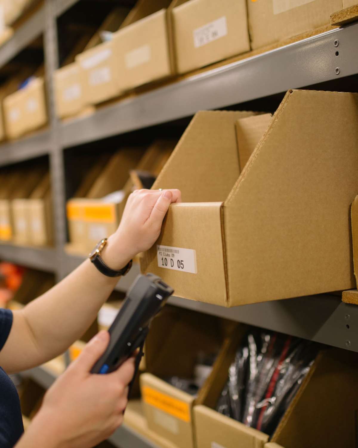 FBM image of employee picking order out of box for FBM